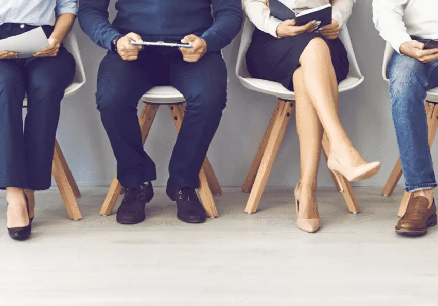 4 People sitting down on chairs
